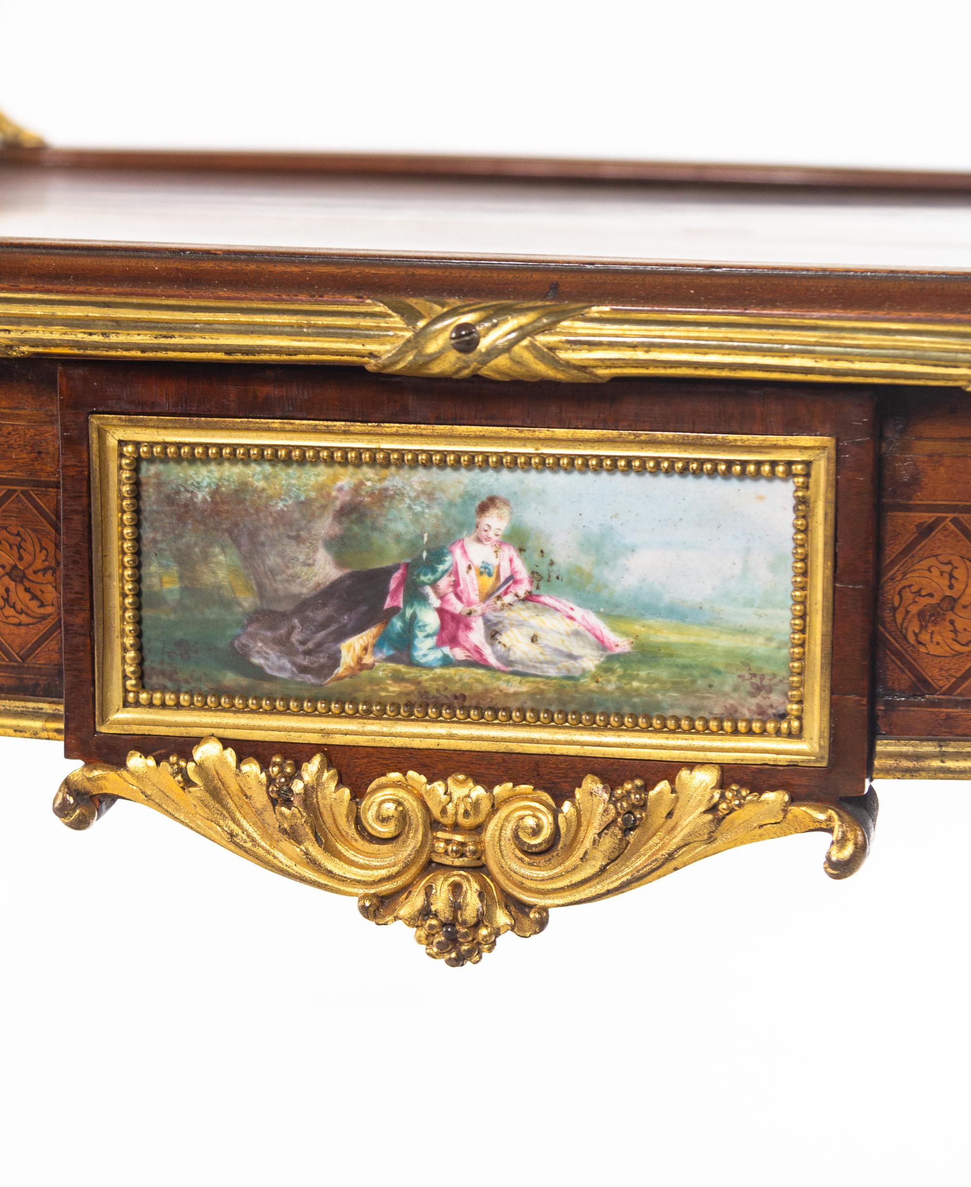 A Louis XV Style Gilt Bronze and Porcelain Mounted Two-Tier Serving Table