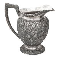 An American Silver Repoussé Three-Piece Coffee Service