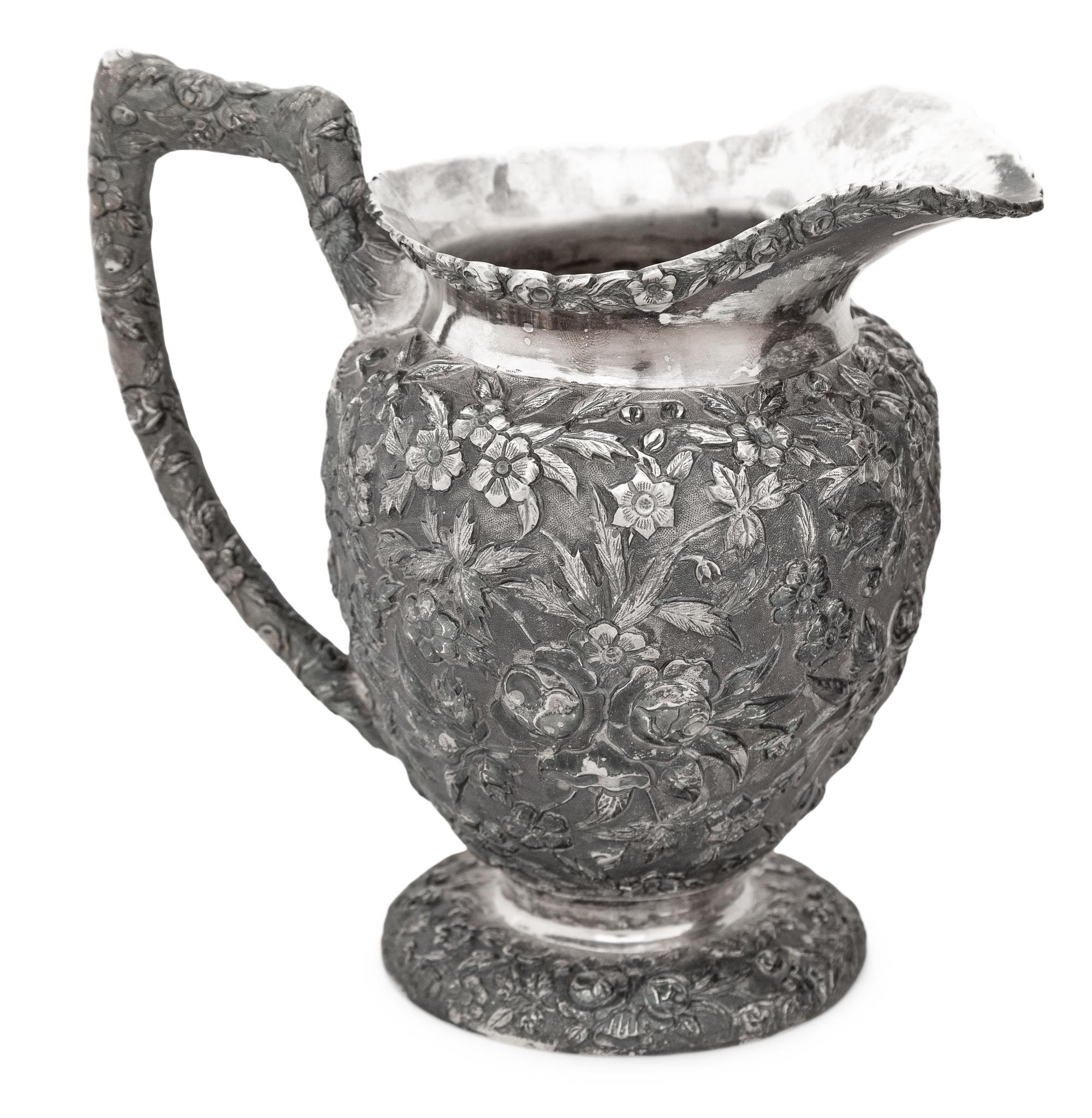 An American Silver Repoussé Three-Piece Coffee Service