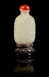 A Carved Jade Snuff Bottle Height 3 3/4 inches (with stand).