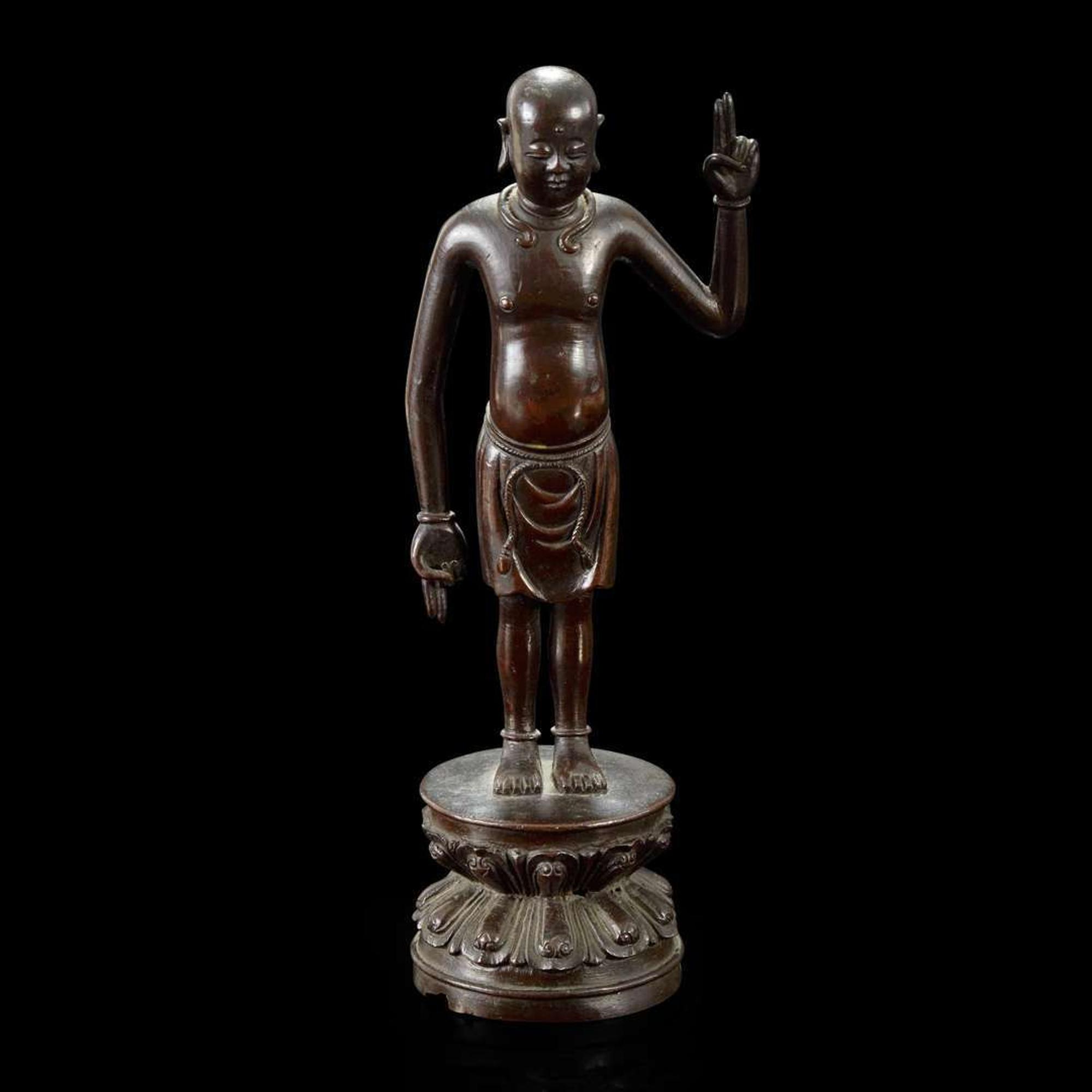 A Chinese bronze figure of the infant Buddha Ming dynasty