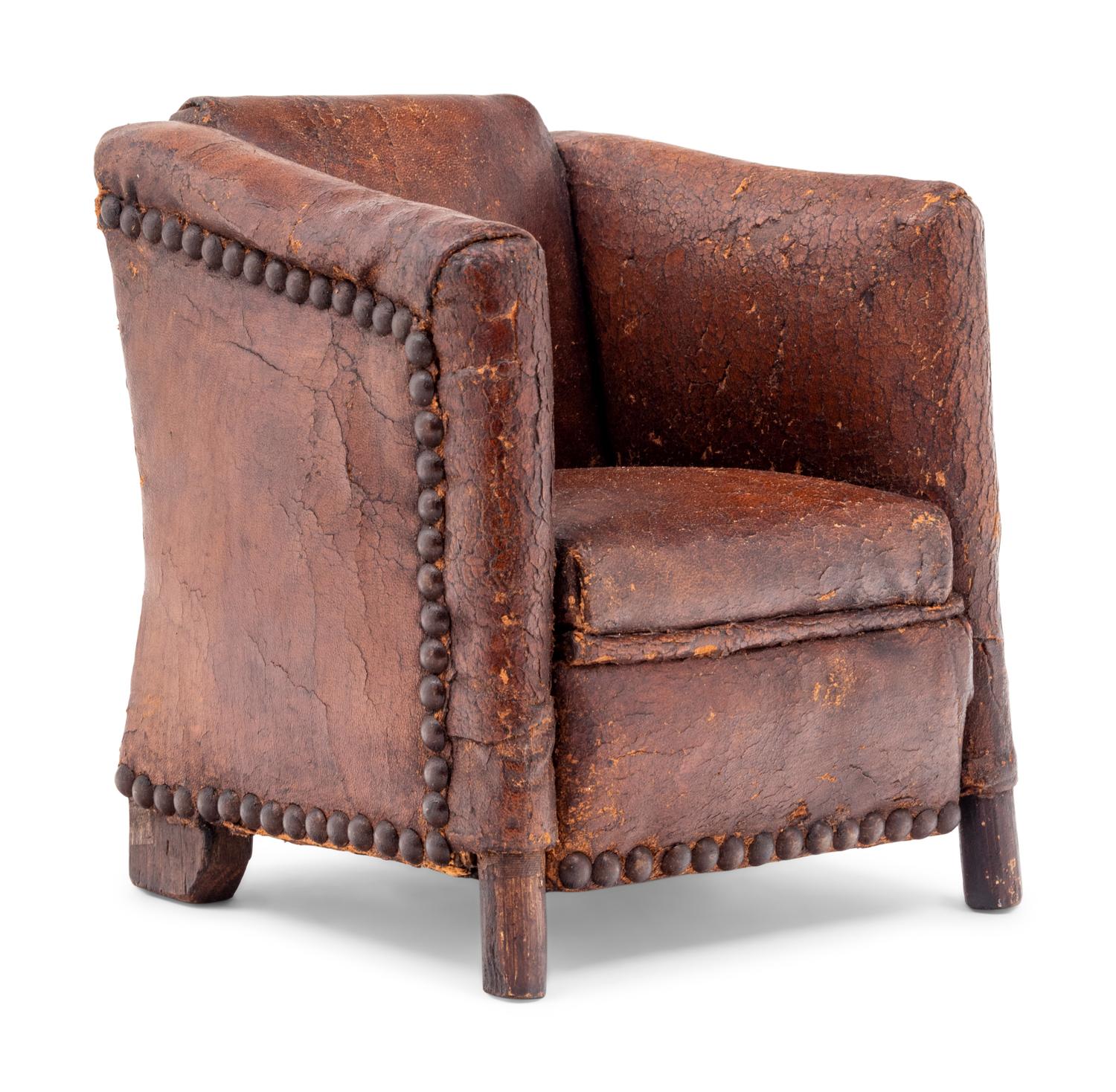 A Diminutive Leather Upholstered Club Chair