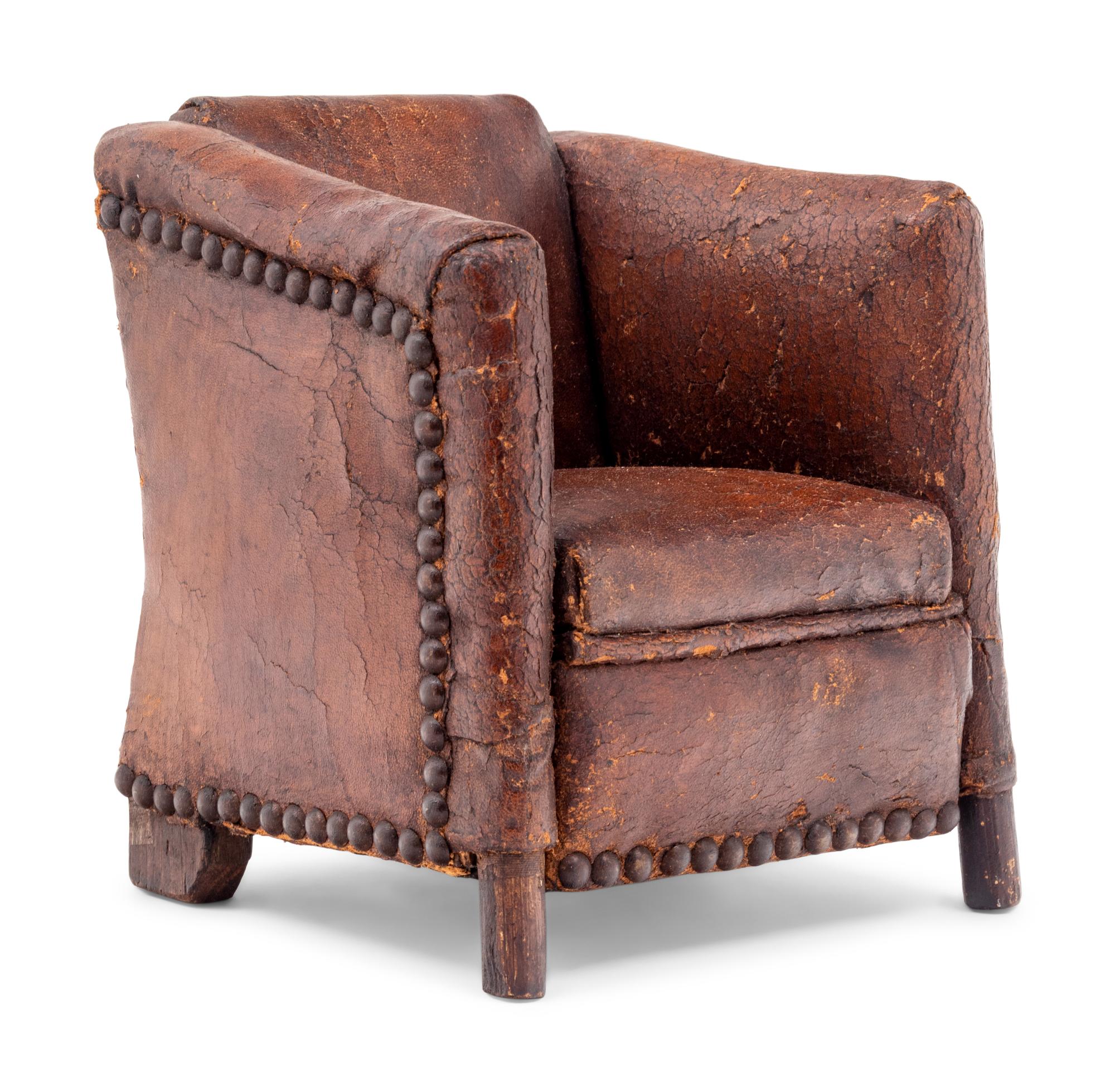 A Diminutive Leather Upholstered Club Chair
