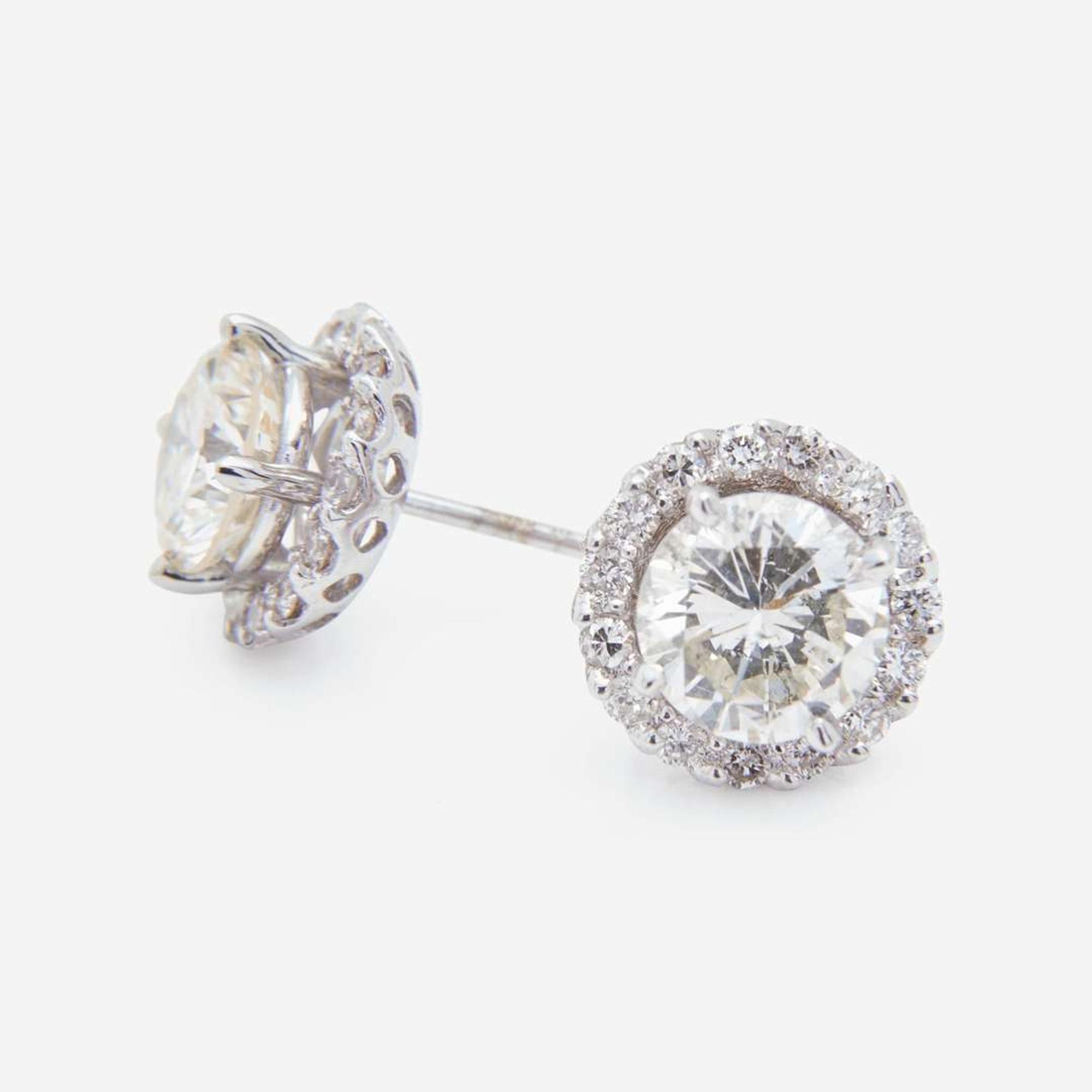 A Pair of 18K White Gold and Diamond Stud Earrings