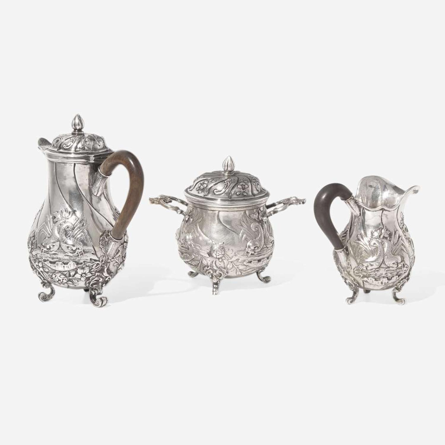 A miniature Continental silver repoussé three-piece coffee service, probably 19th century