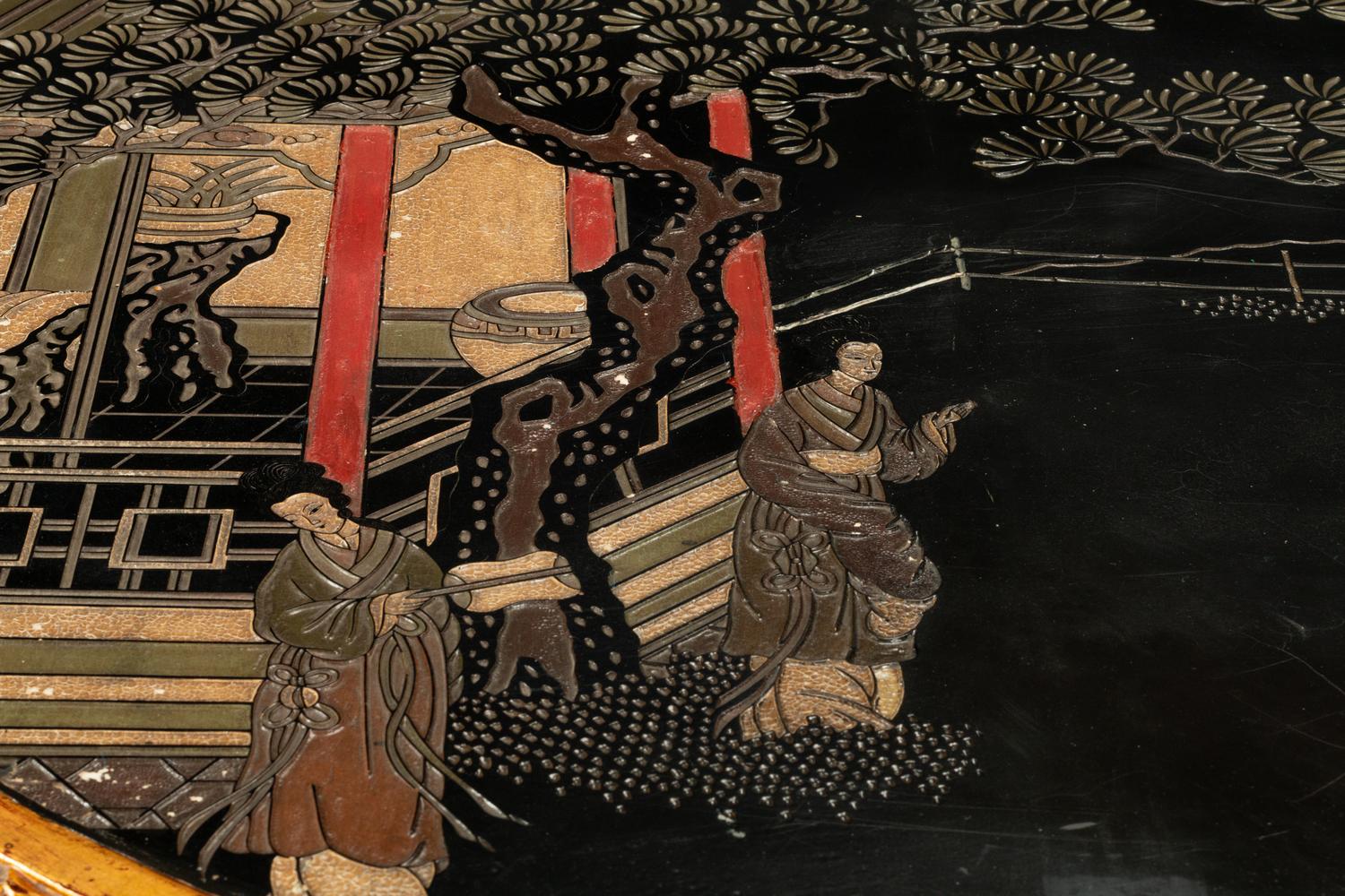 A Continental Giltwood Center Table with a Chinese Lacquer Top