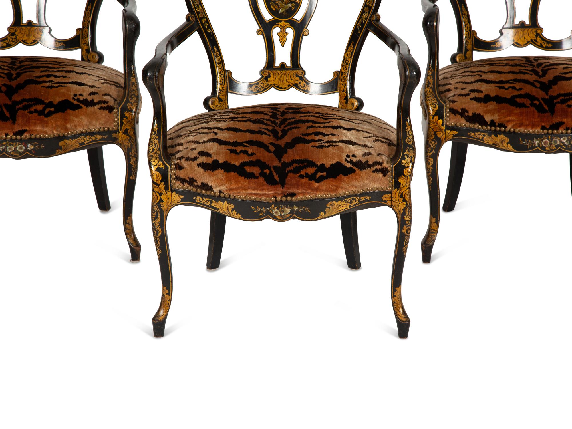 A Set of Three Victorian Ebonized Gilt and Mother of Pearl Chinoiserie Open Armchairs