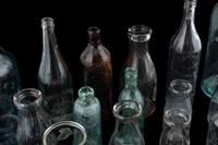 Sixteen Glass Advertising Bottles