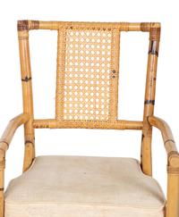 A Bamboo and Rattan Dining Set comprising a table and six chairs.