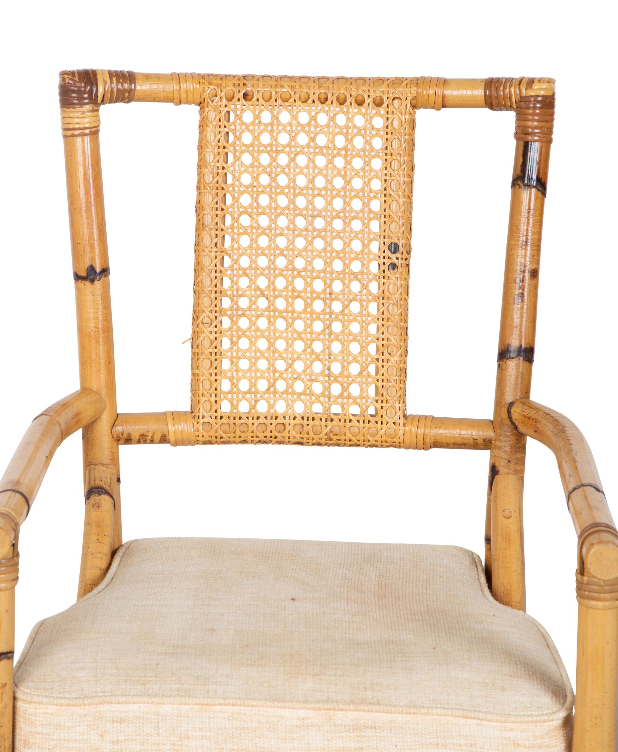 A Bamboo and Rattan Dining Set comprising a table and six chairs.