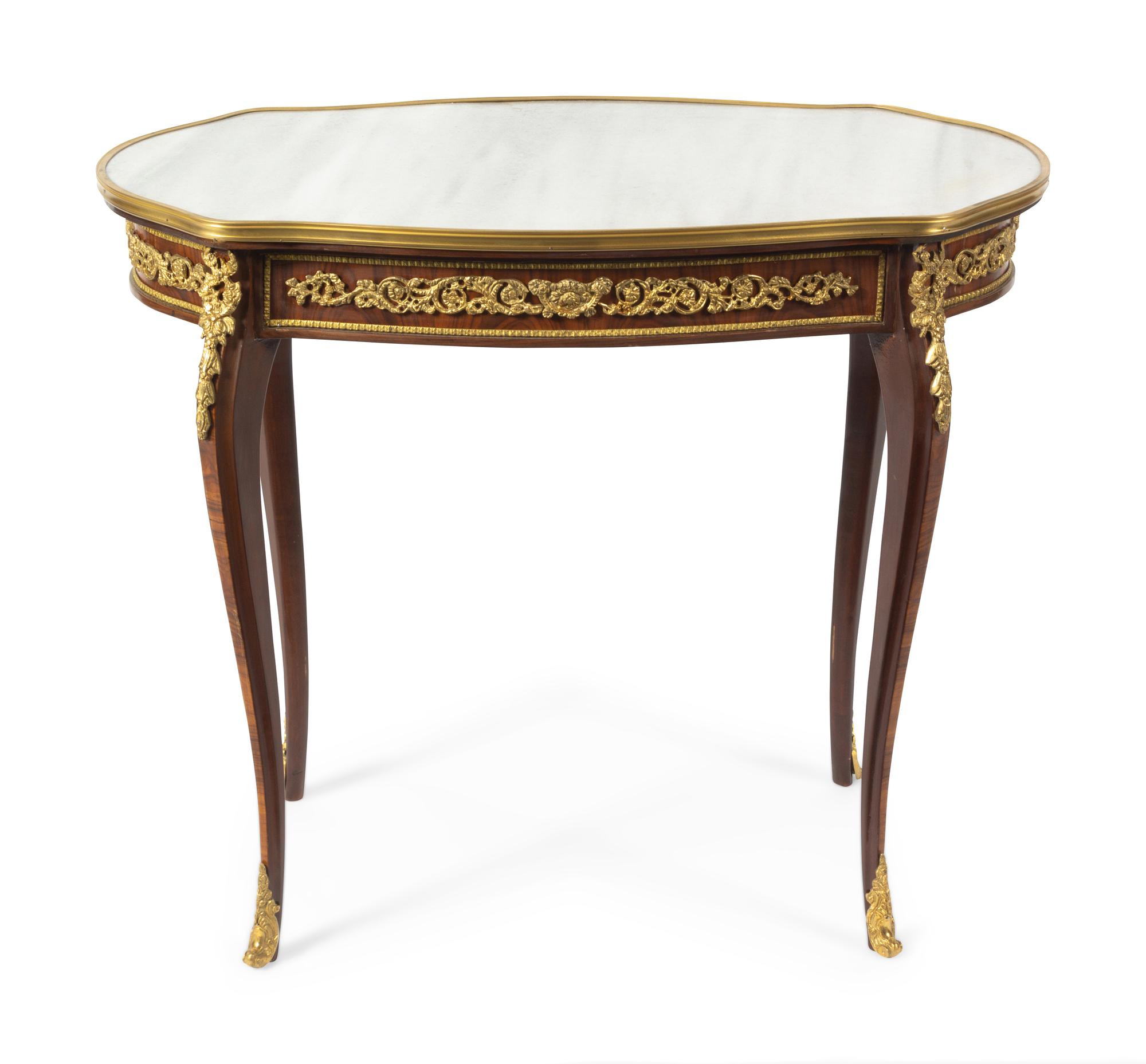 A Louis XV Style Gilt Bronze Mounted Table