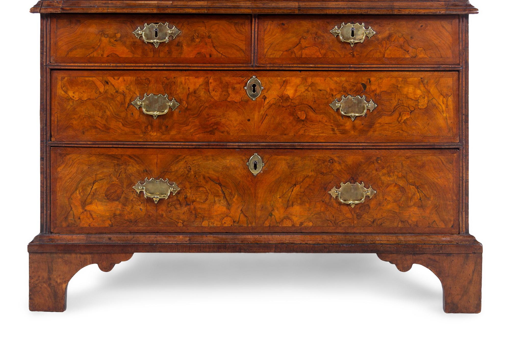A George I Carved Burl Walnut Double-Dome Bureau Bookcase