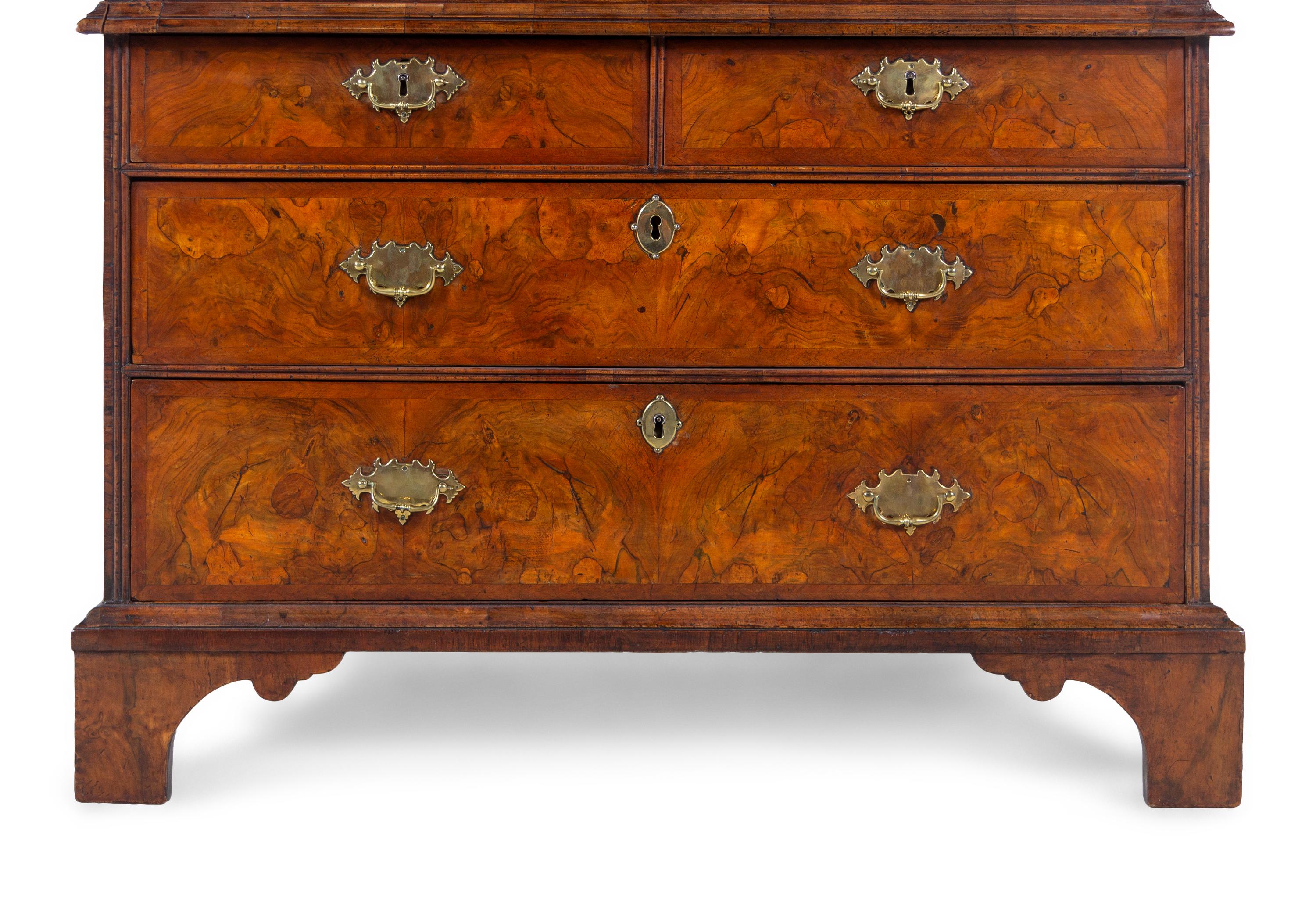 A George I Carved Burl Walnut Double-Dome Bureau Bookcase