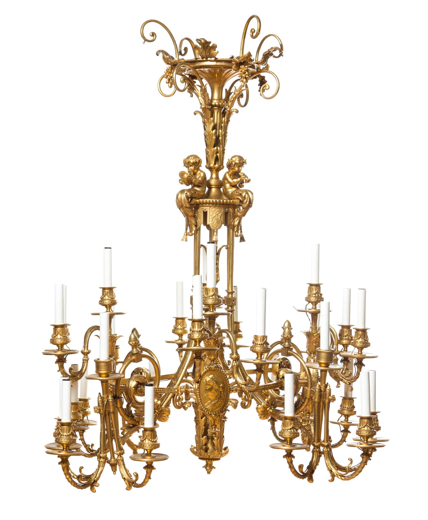 A Neoclassical Gilt Bronze Twenty-Eight-Light Chandelier Height 42 x diameter 37 inches.