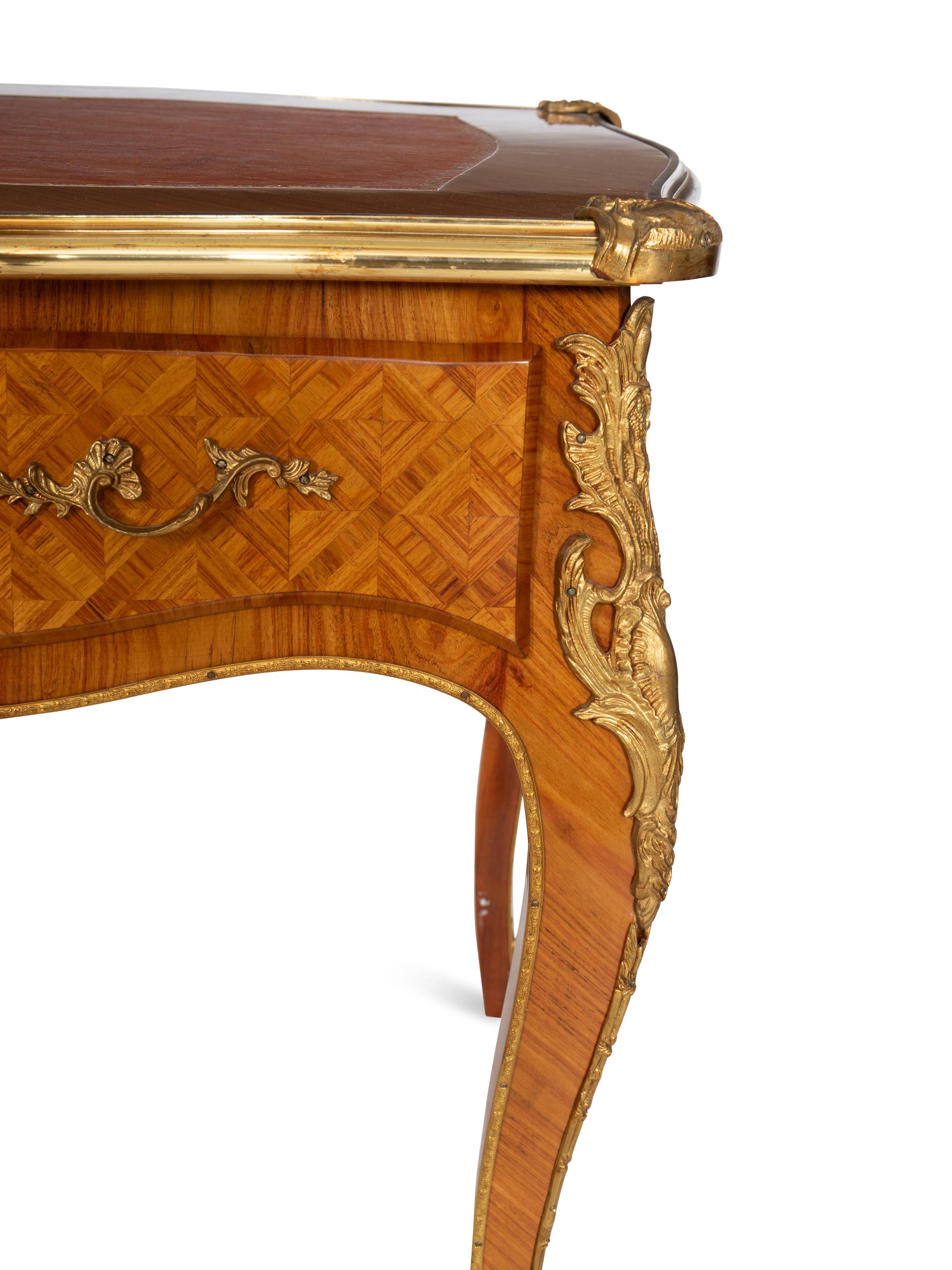 A Louis XV Style Gilt Bronze Mounted Parquetry Bureau Plat and Regency Style Parcel Gilt Chair