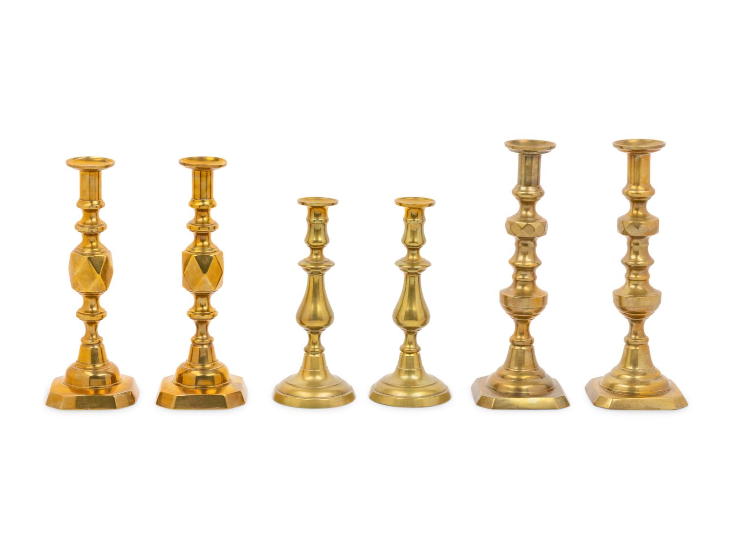 Three Pairs of English Brass Candlesticks