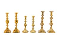 Three Pairs of English Brass Candlesticks