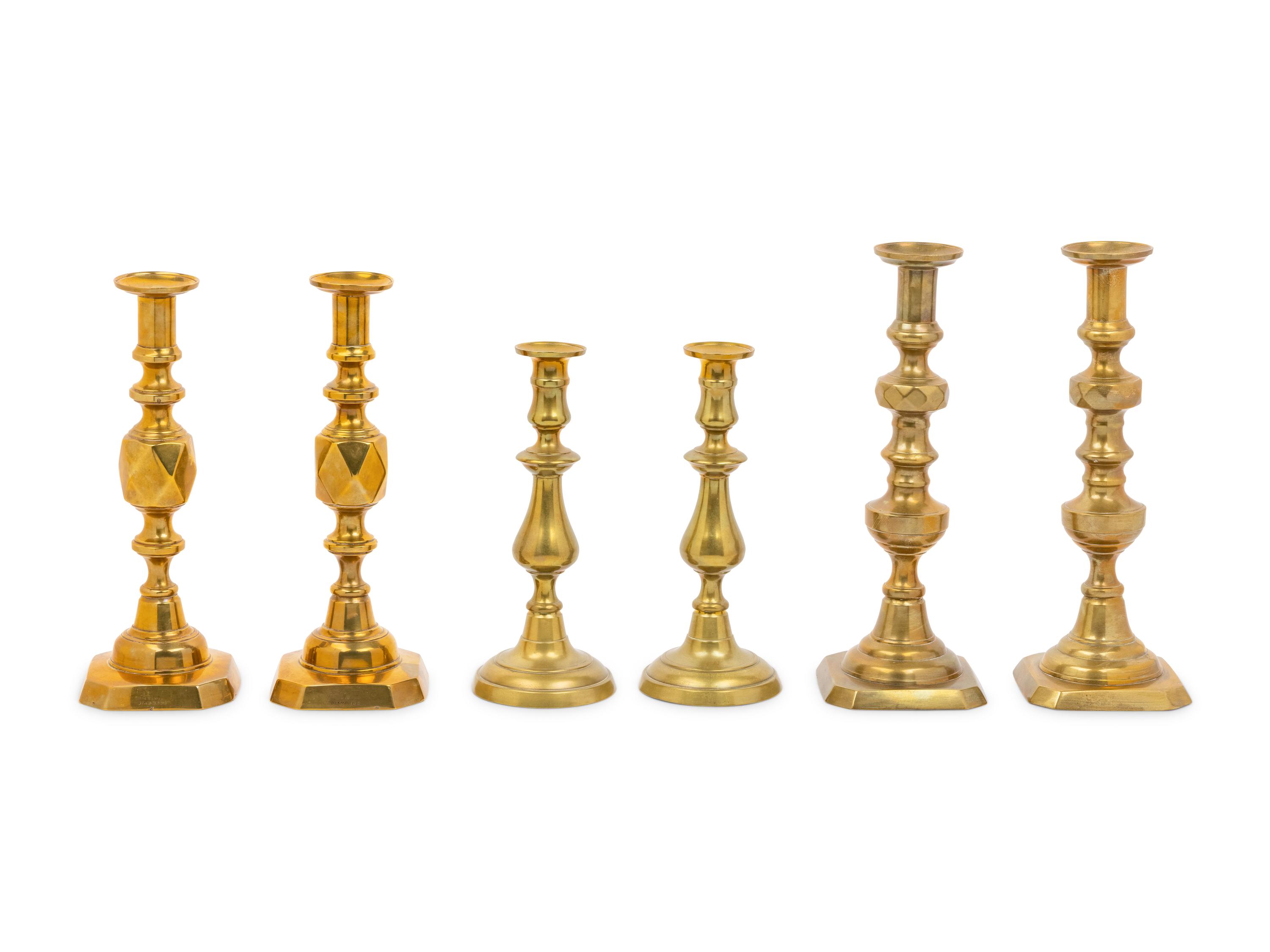 Three Pairs of English Brass Candlesticks