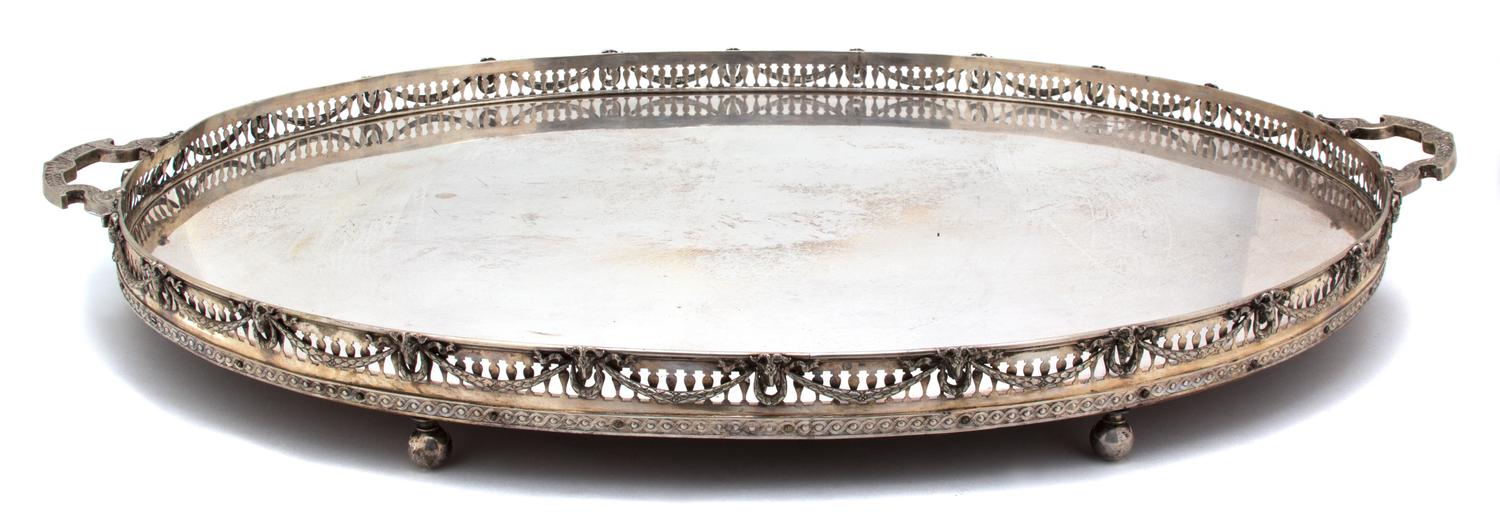 A Continental Silver Two-Handle Tray, 19TH CENTURY, having a pierced gallery, with goat's head and laurel swag decoration on a mahogany