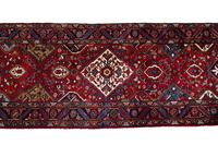 A Persian Wool Runner 19 feet 2 inches x 3 feet 5 inches. — 20TH CENTURY