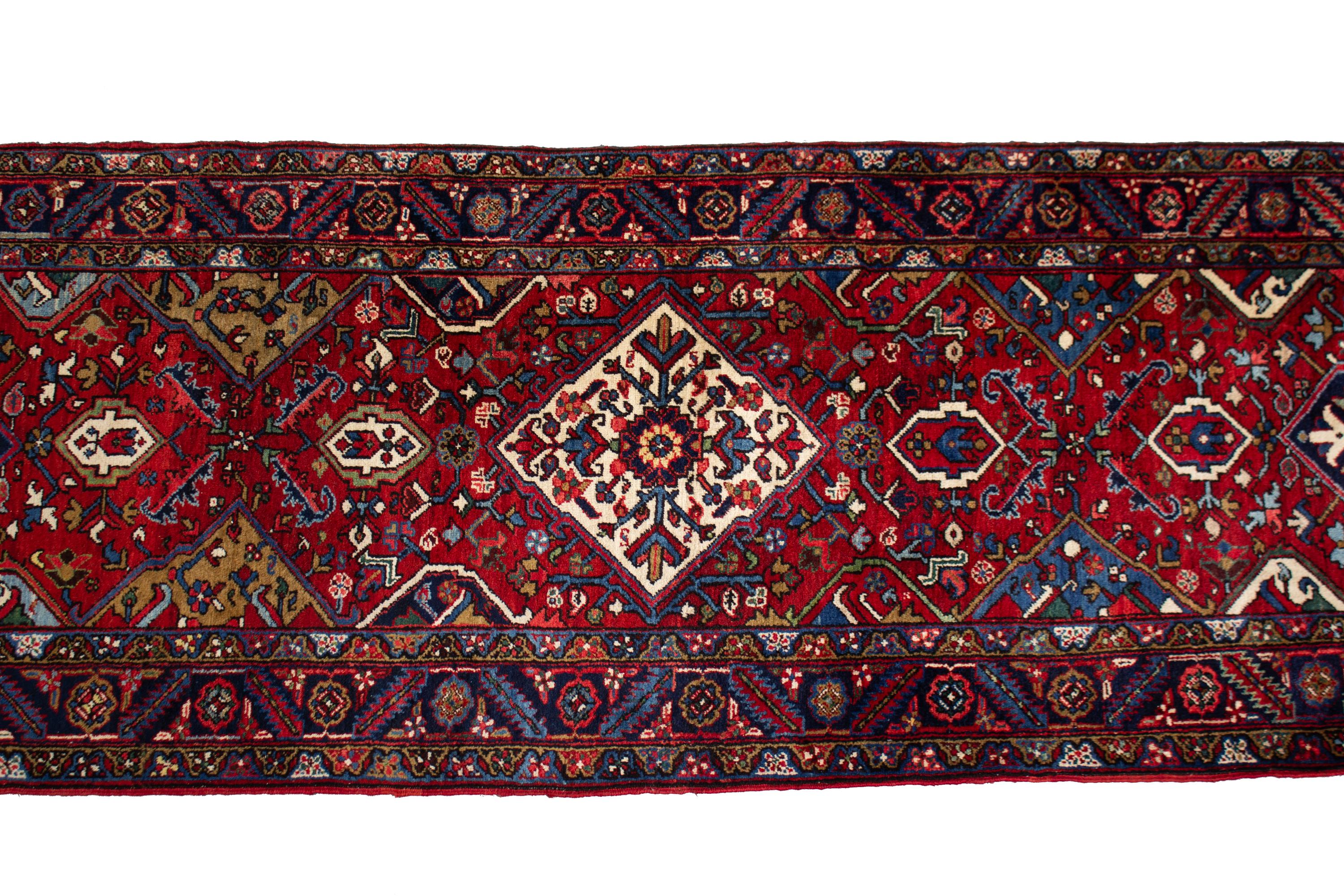 A Persian Wool Runner 19 feet 2 inches x 3 feet 5 inches. — 20TH CENTURY
