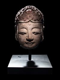 A Pair of Chinese Carved Stone Heads of Buddha