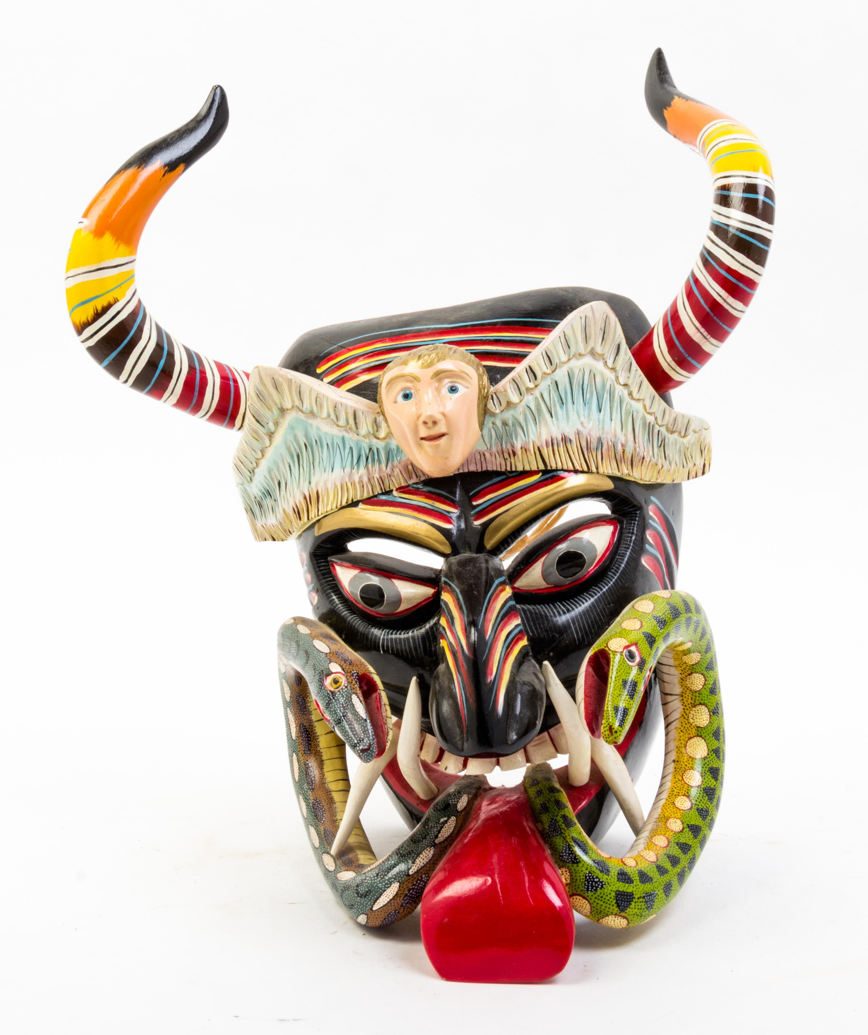 A Mexican Painted Mask Height 15 1/2 inches.