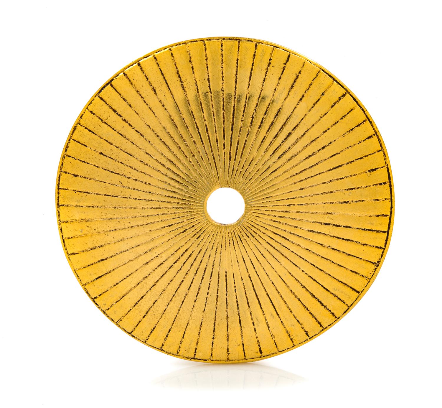 An Yves Saint Laurent Goldtone Disc Pendent, 3.75" diameter.
