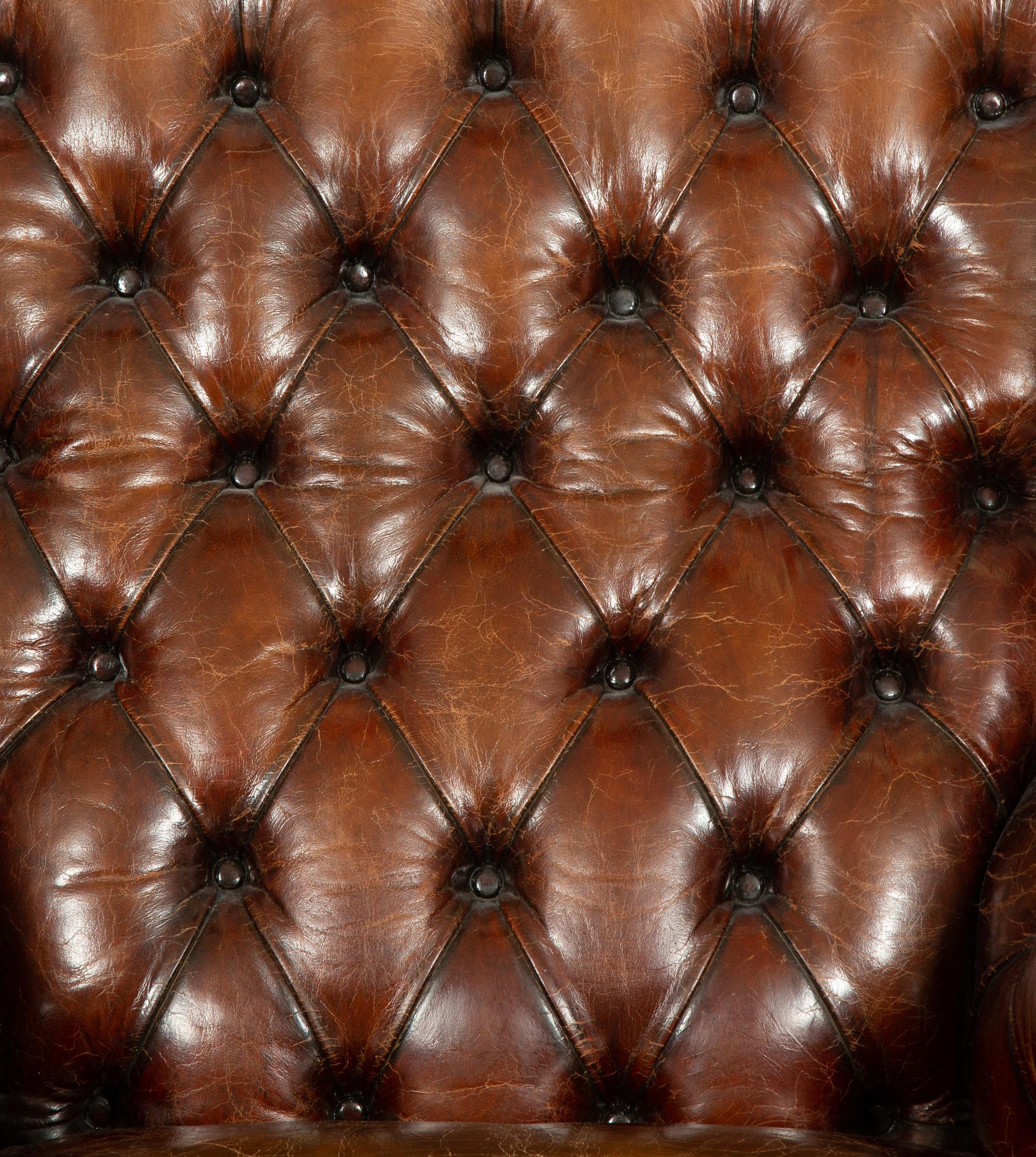 A George III Style Leather Wingback Armchair