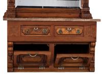 An Eastlake Style Hall Mirror with Marble Top Cabinet Base