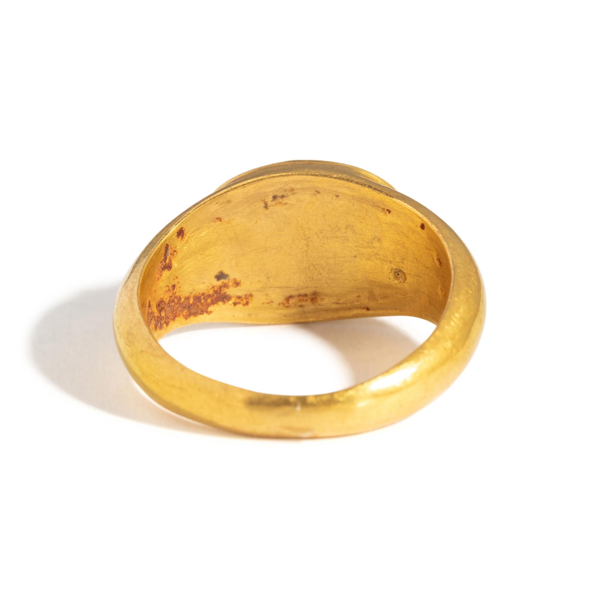 A Roman Gold and Garnet Finger Ring with the Goddesses Athena and Nike