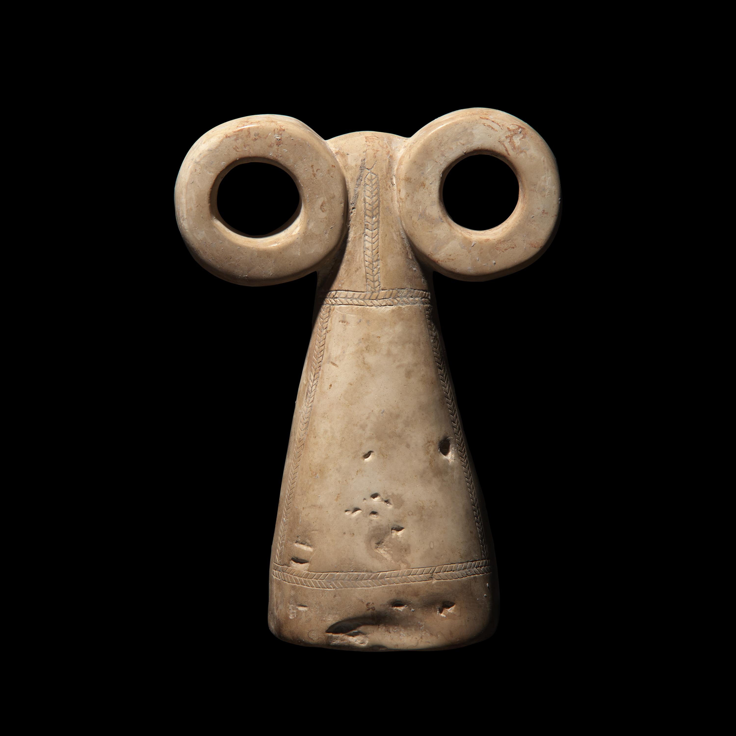 A Mesopotamian Stone Spectacle Idol