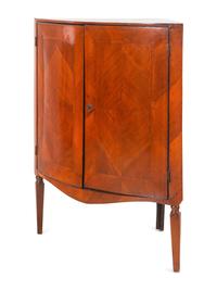 A Continental Bookmatch Veneered Corner Cabinet