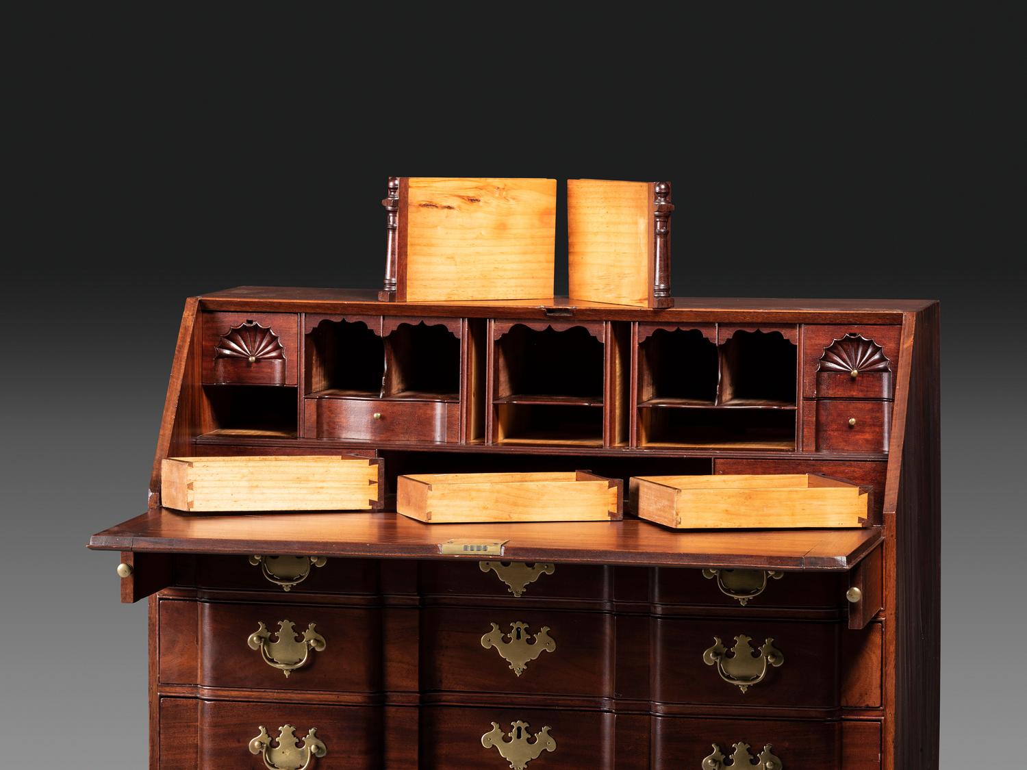 A Chippendale Figured Mahogany Block-Front Claw-and-Ball Foot Slant-Front Desk