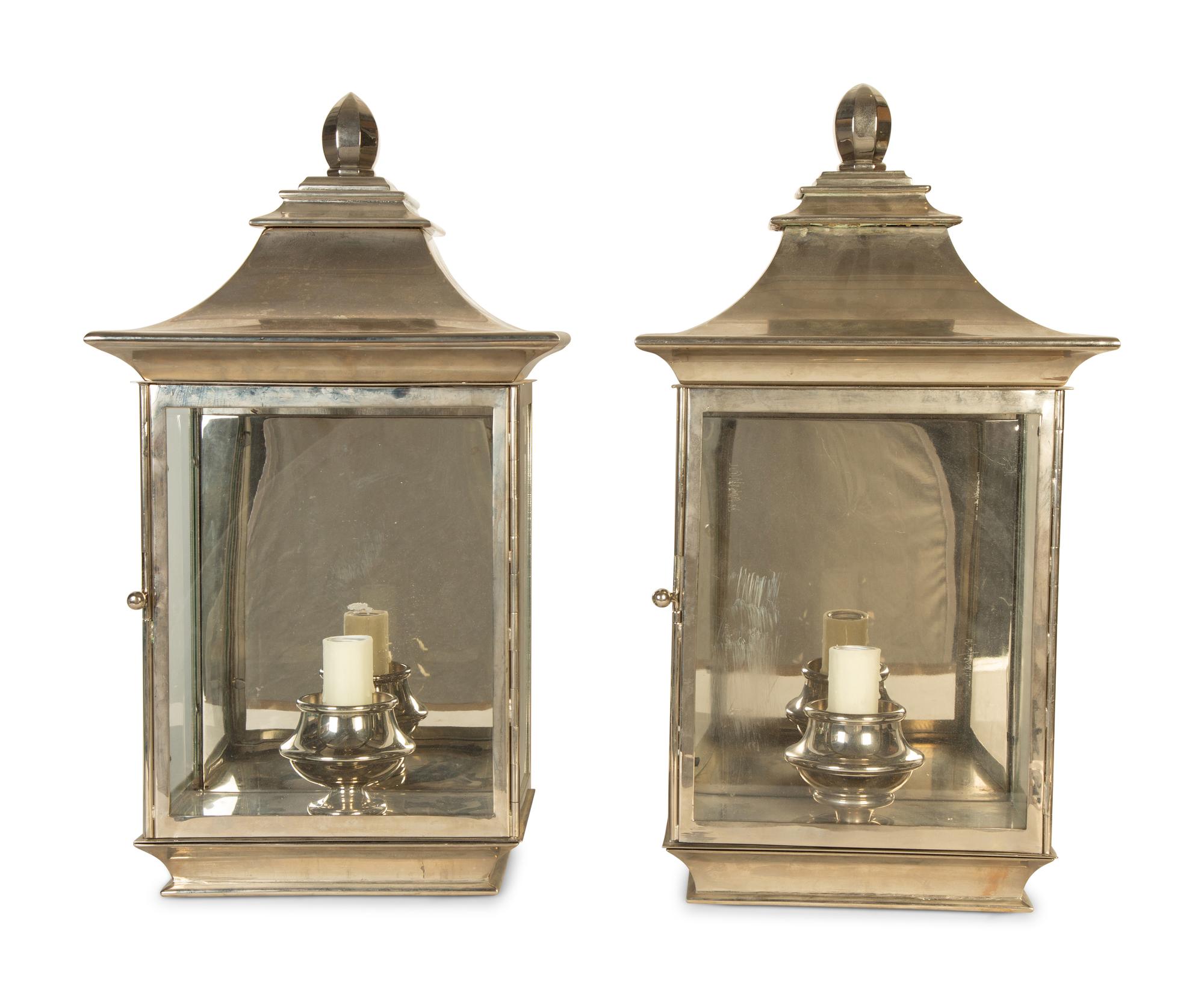 A Pair of Polished Silvered Metal and Glass Wall Lanterns