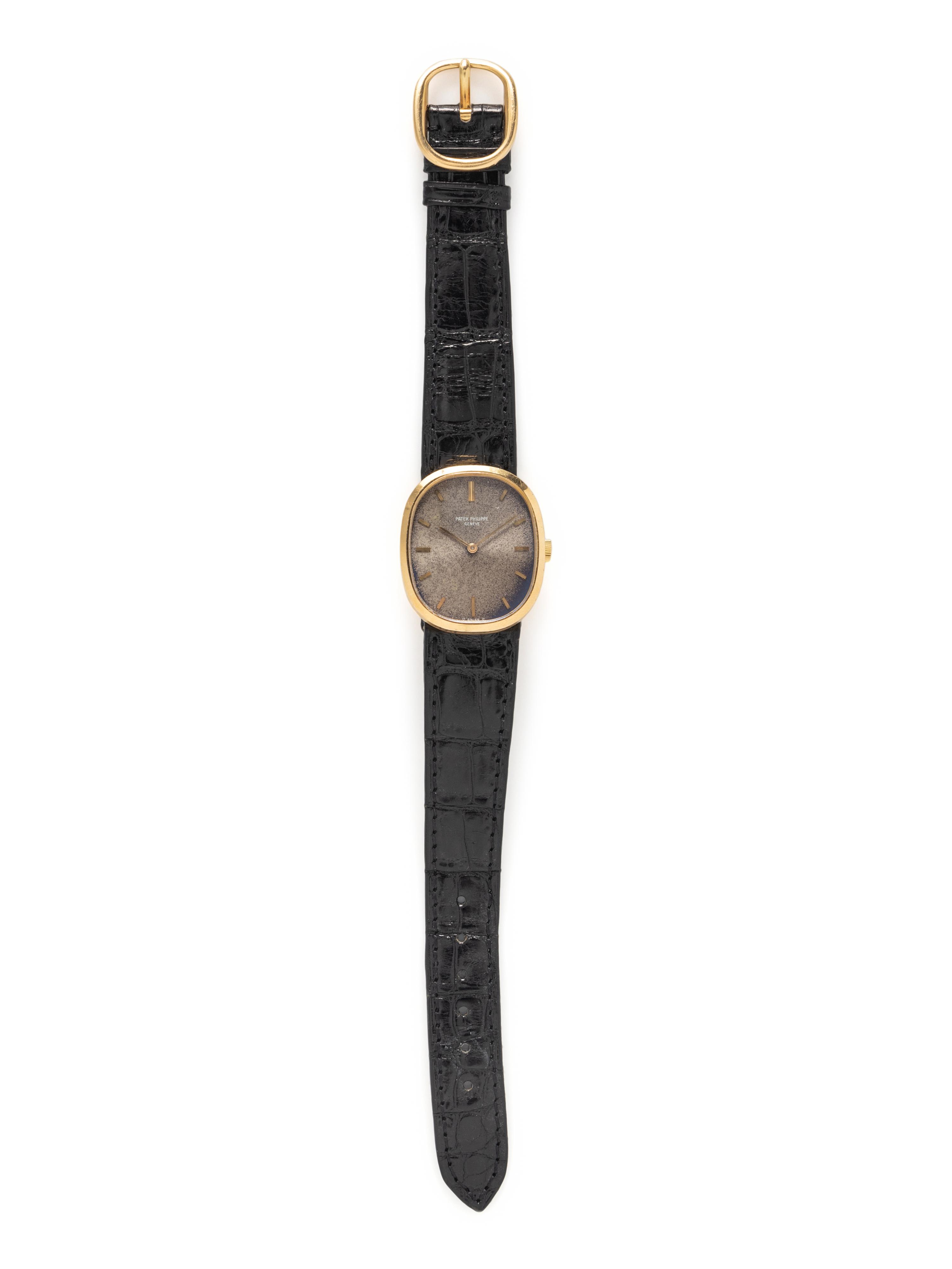 PATEK PHILIPPE, 18K YELLOW GOLD 'ELLIPSE' WATCH WITH TROPICAL BLUE DIAL