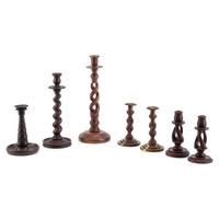 A Group of Seven Turned Wood Candlesticks