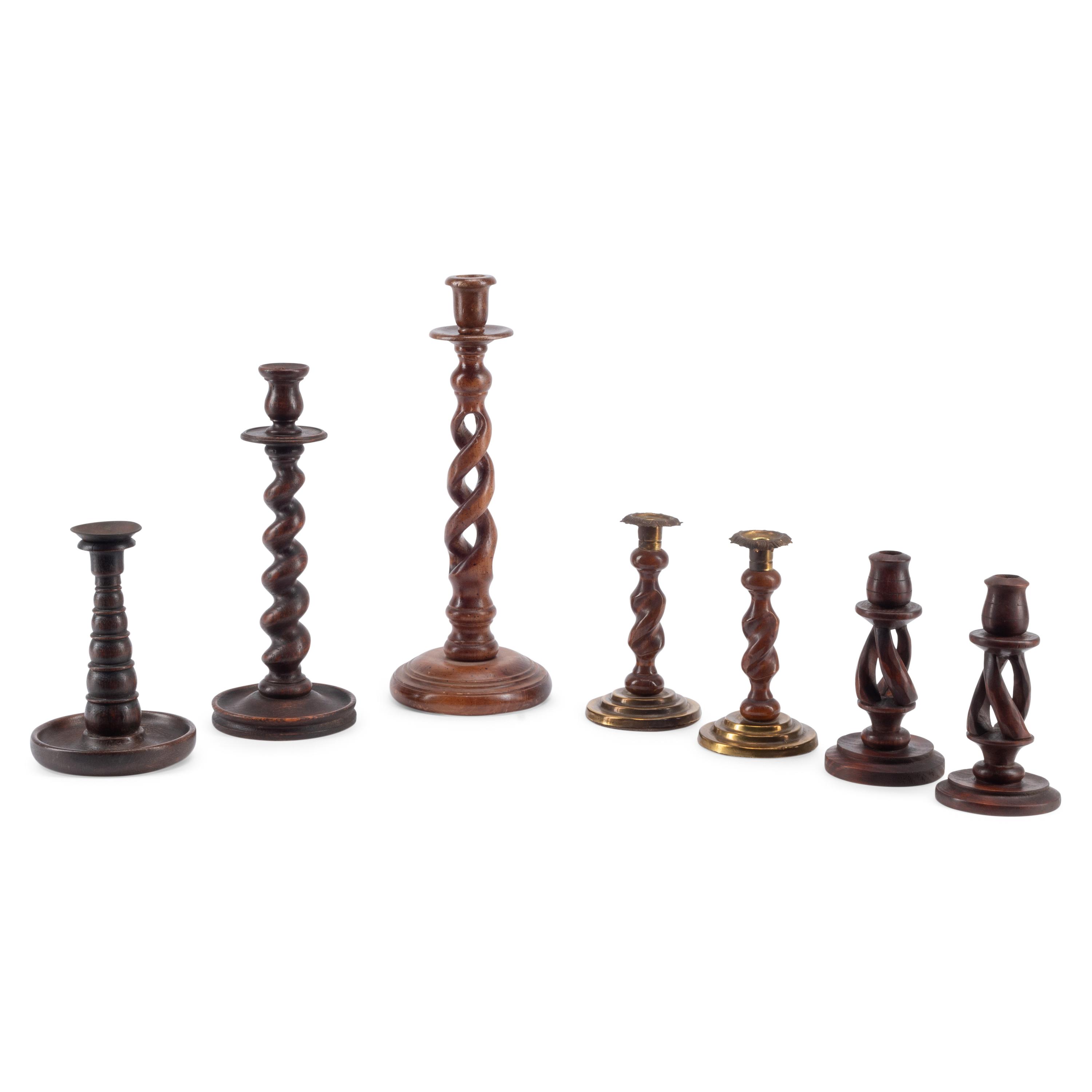 A Group of Seven Turned Wood Candlesticks