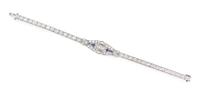 An Art Deco Platinum, Diamond and Synthetic Sapphire Bracelet, 11.60 dwts.