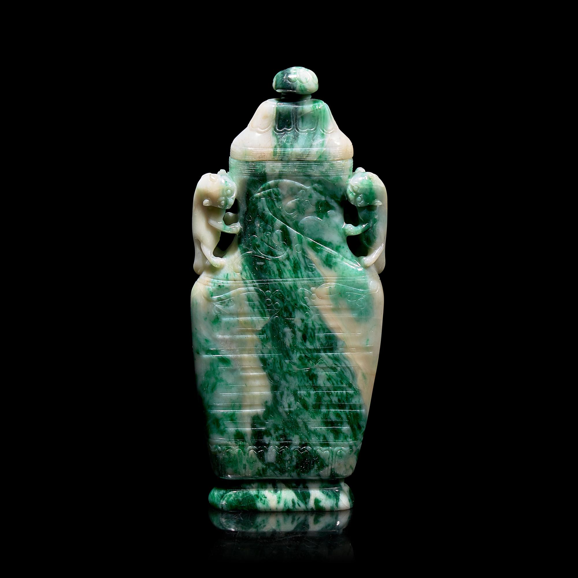 A Chinese Carved Jadeite Vase and Cover 翡翠夔龍紋雙耳蓋瓶