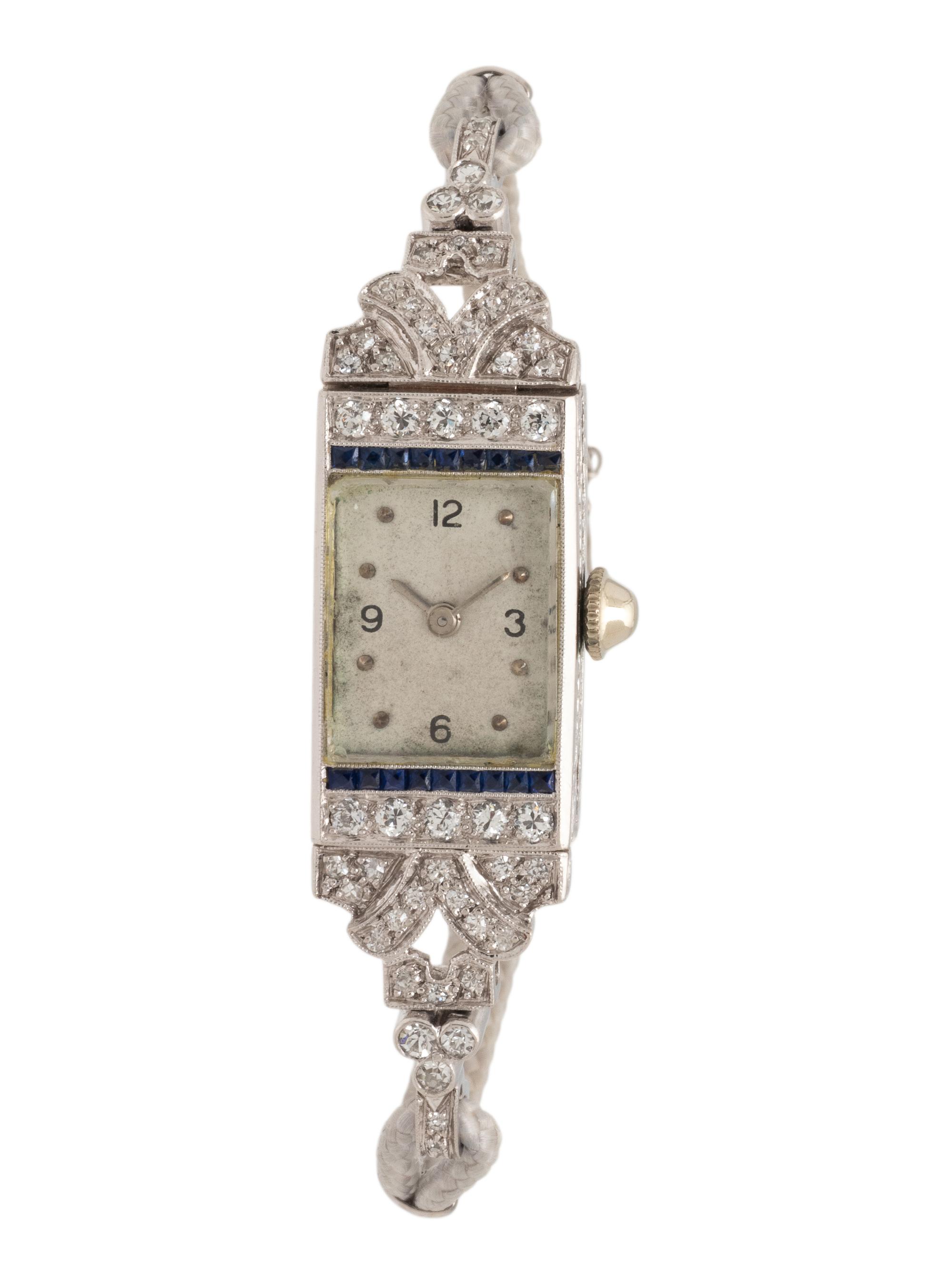 DIAMOND, SAPPHIRE, AND PLATINUM WATCH