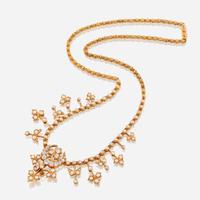 A fourteen karat gold, cultured pearl, and diamond necklace