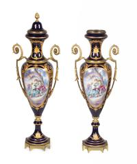 A Pair of Sèvres Style Gilt Metal Mounted Porcelain Covered Urns