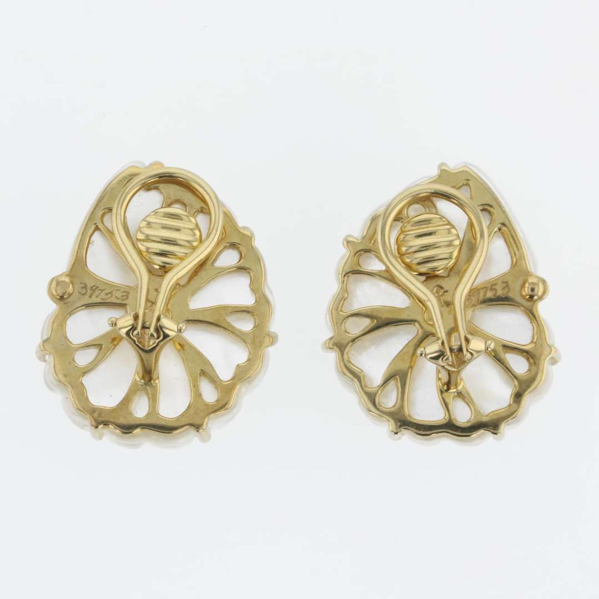 A pair of 18K yellow gold, rock crystal, and blue topaz ear clips, Trianon Nautilus