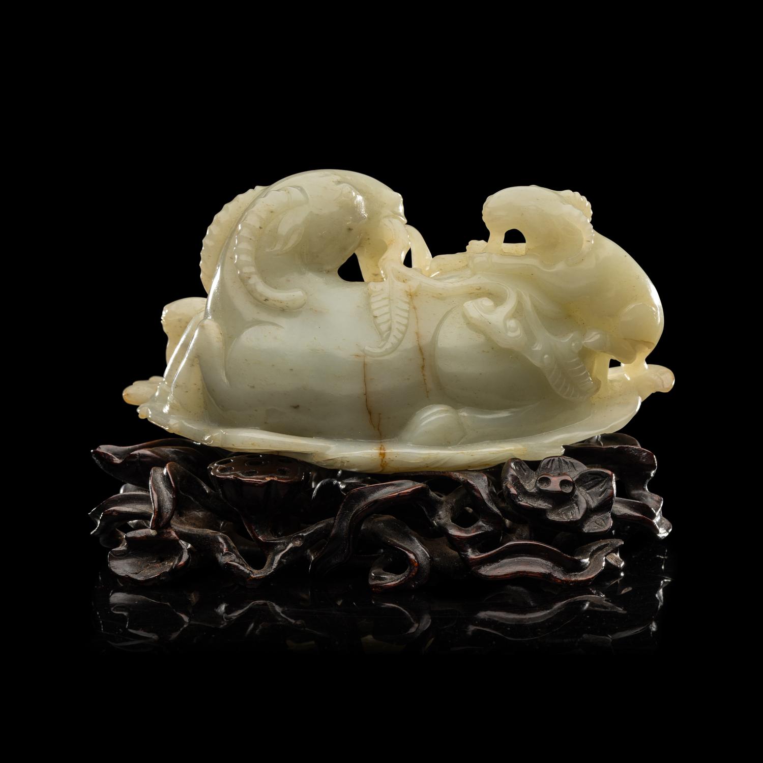 A Chinese Pale Celadon Jade 'Three Rams' Carving 青白玉三羊開泰