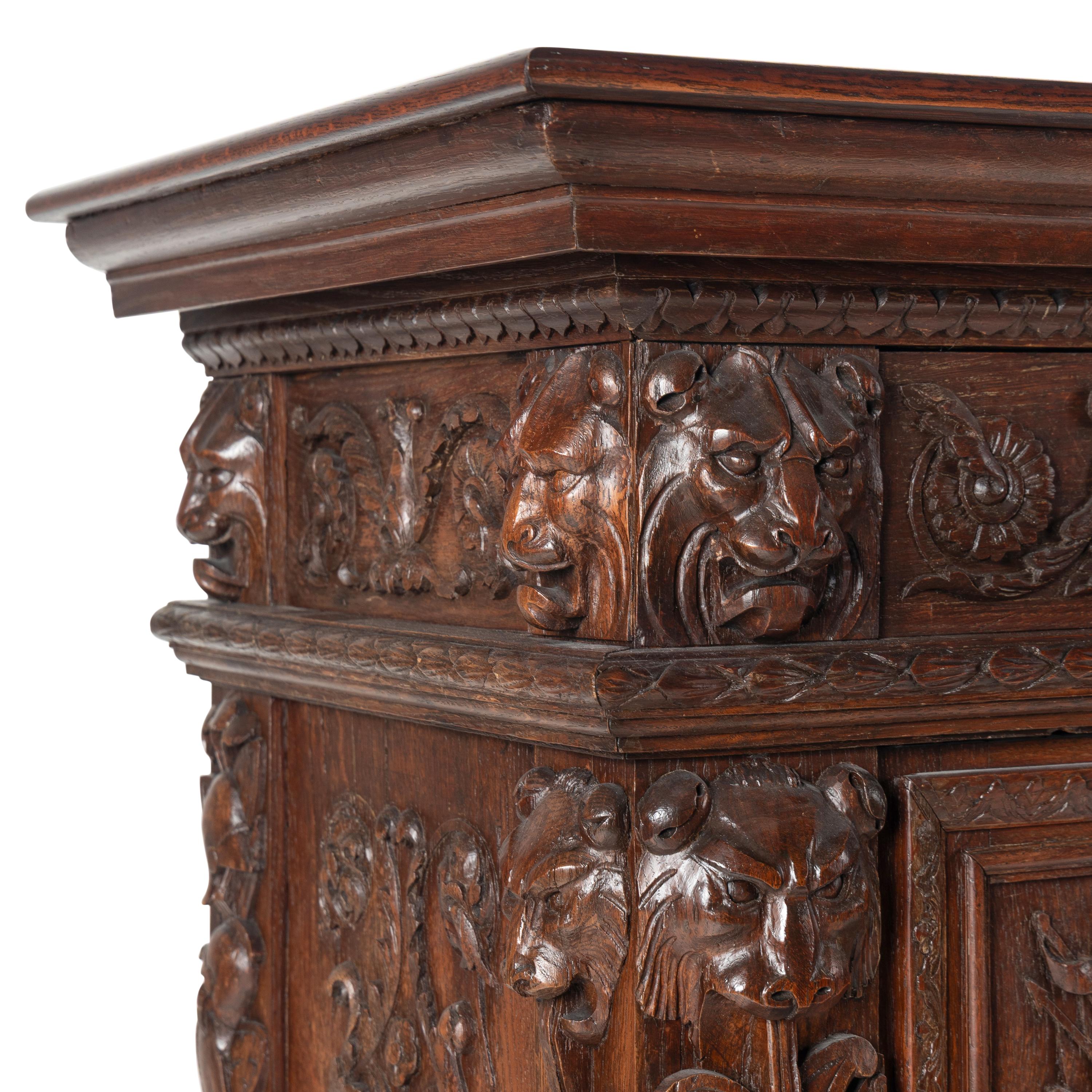 An Italian Renaissance Revival Carved Oak Cabinet