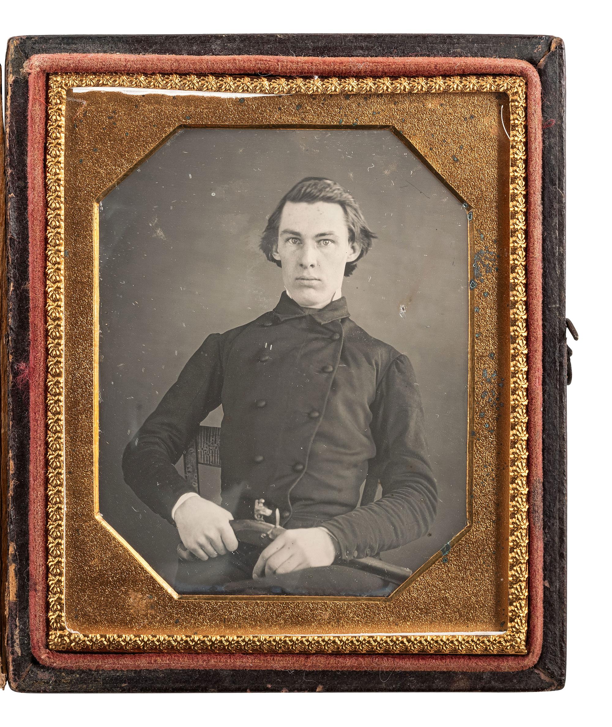 [EARLY PHOTOGRAPHY]. Sixth plate daguerreotype of a gentleman armed with a flintlock pistol.