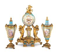 A Sèvres Style Porcelain and Gilt Bronze Mounted Three-Piece Clock Garniture