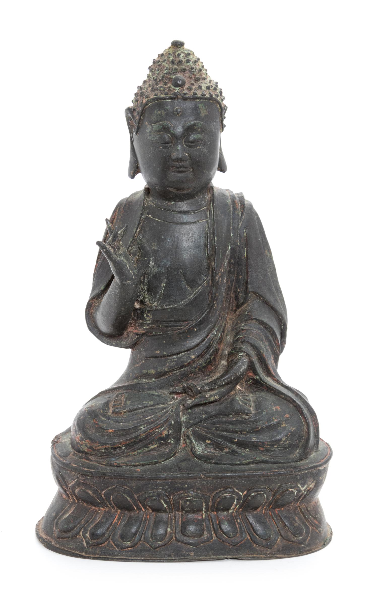 A Bronze Figure of Shakyamuni Buddha Height 10 1/4 inches. — LIKELY MING DYNASTY (1368-1644)