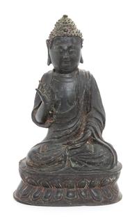 A Bronze Figure of Shakyamuni Buddha Height 10 1/4 inches. — LIKELY MING DYNASTY (1368-1644)